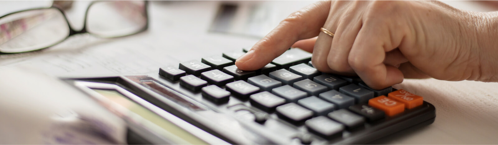 woman using calculator